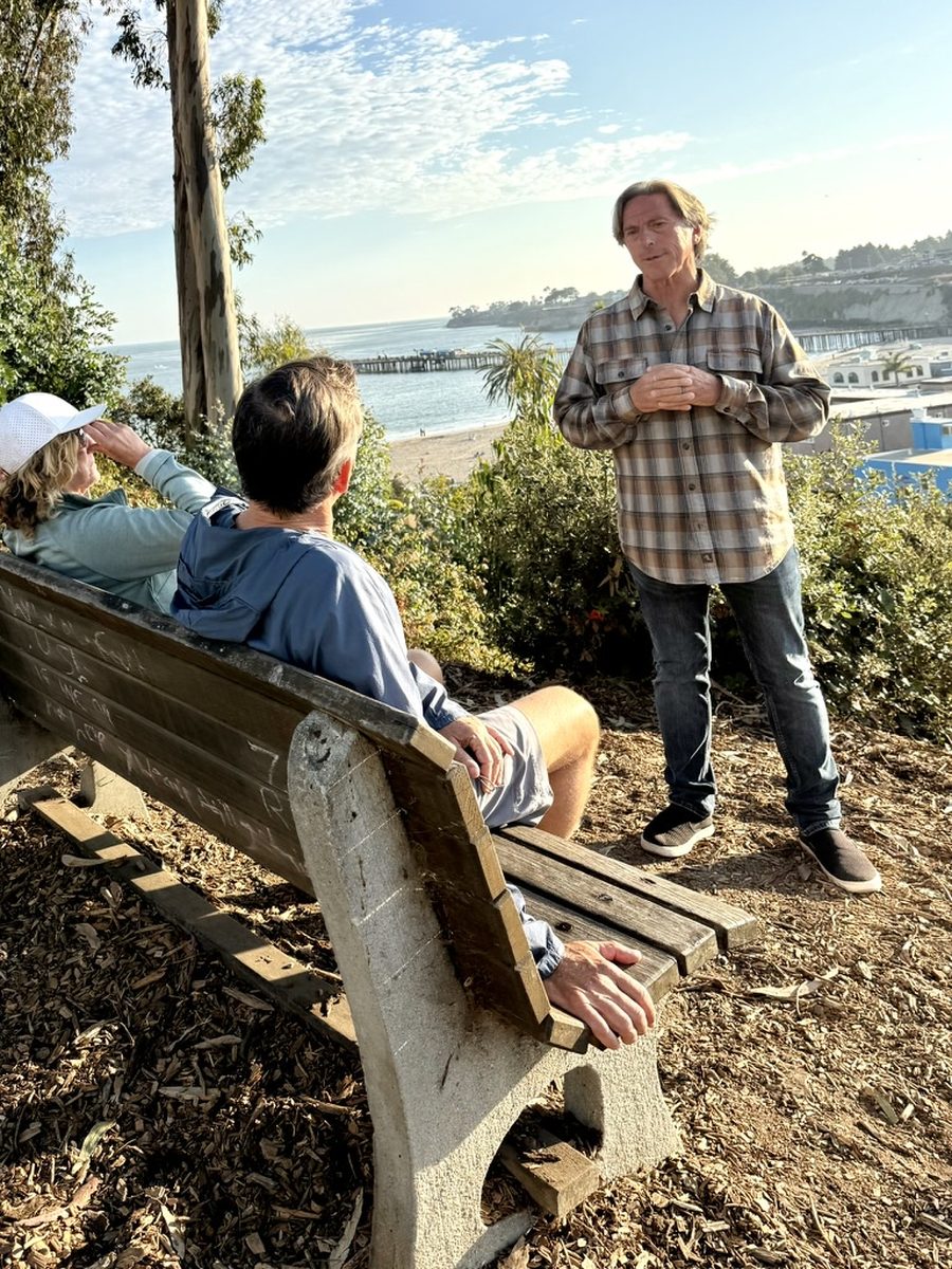 TJ Welch talking with Capitola residents above the beach